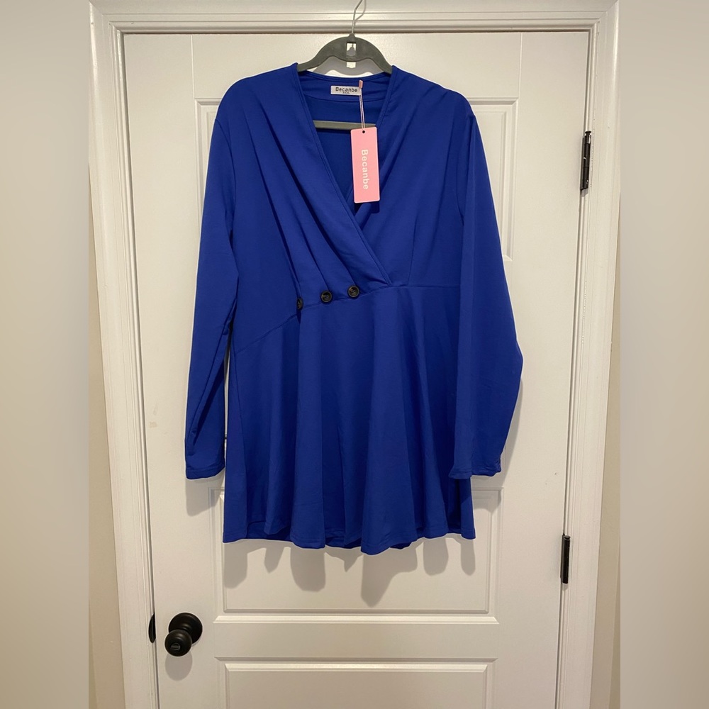 Royal blue faux wrap long top.  Fits like a size Size XXL. New with tags.